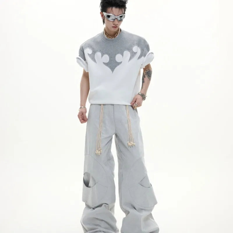 Men's grey cotton t-shirt with burnt flower embroidery and rhinestone details on the front.