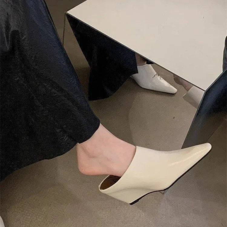 Women's Wind Wedge closed toe half slipper in PU leather, showing wedge heel design.