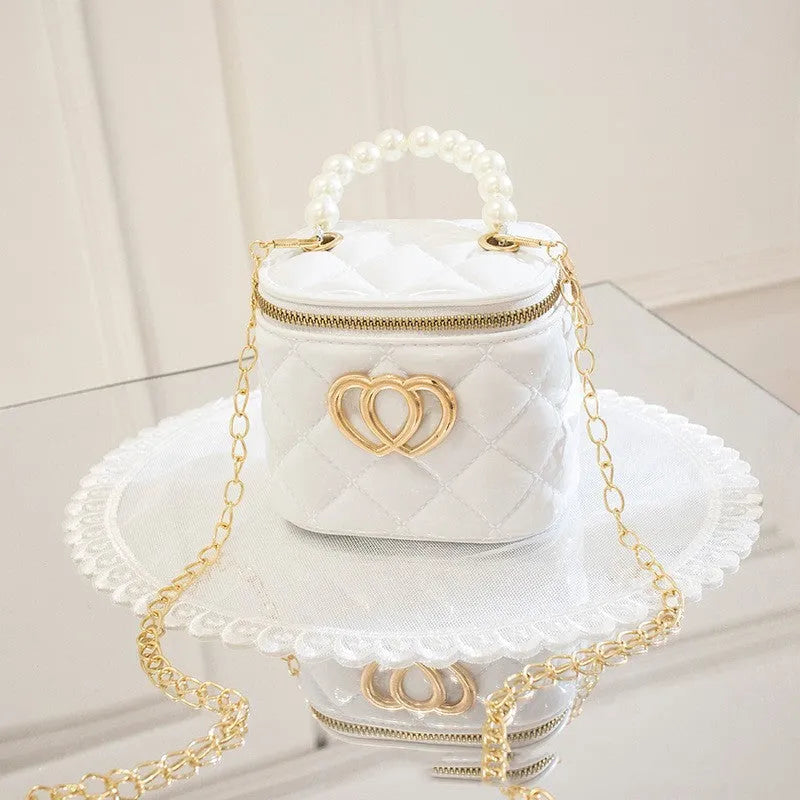 Women's PVC bucket gel bag with heart-shaped pattern in assorted colours.