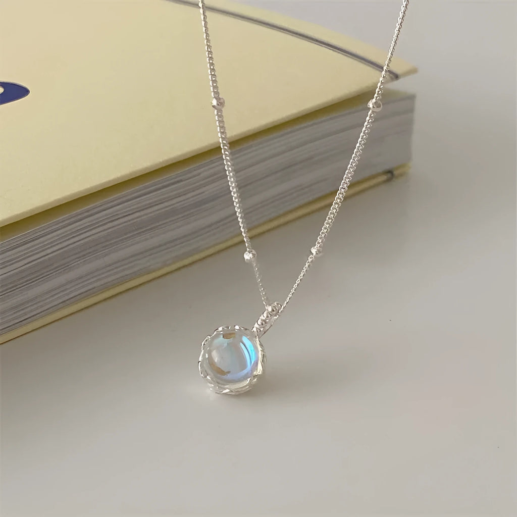 Geometric ornamental stone pendant on a 925 sterling silver curb chain necklace for women.