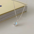 Geometric ornamental stone pendant on a 925 sterling silver curb chain necklace for women.