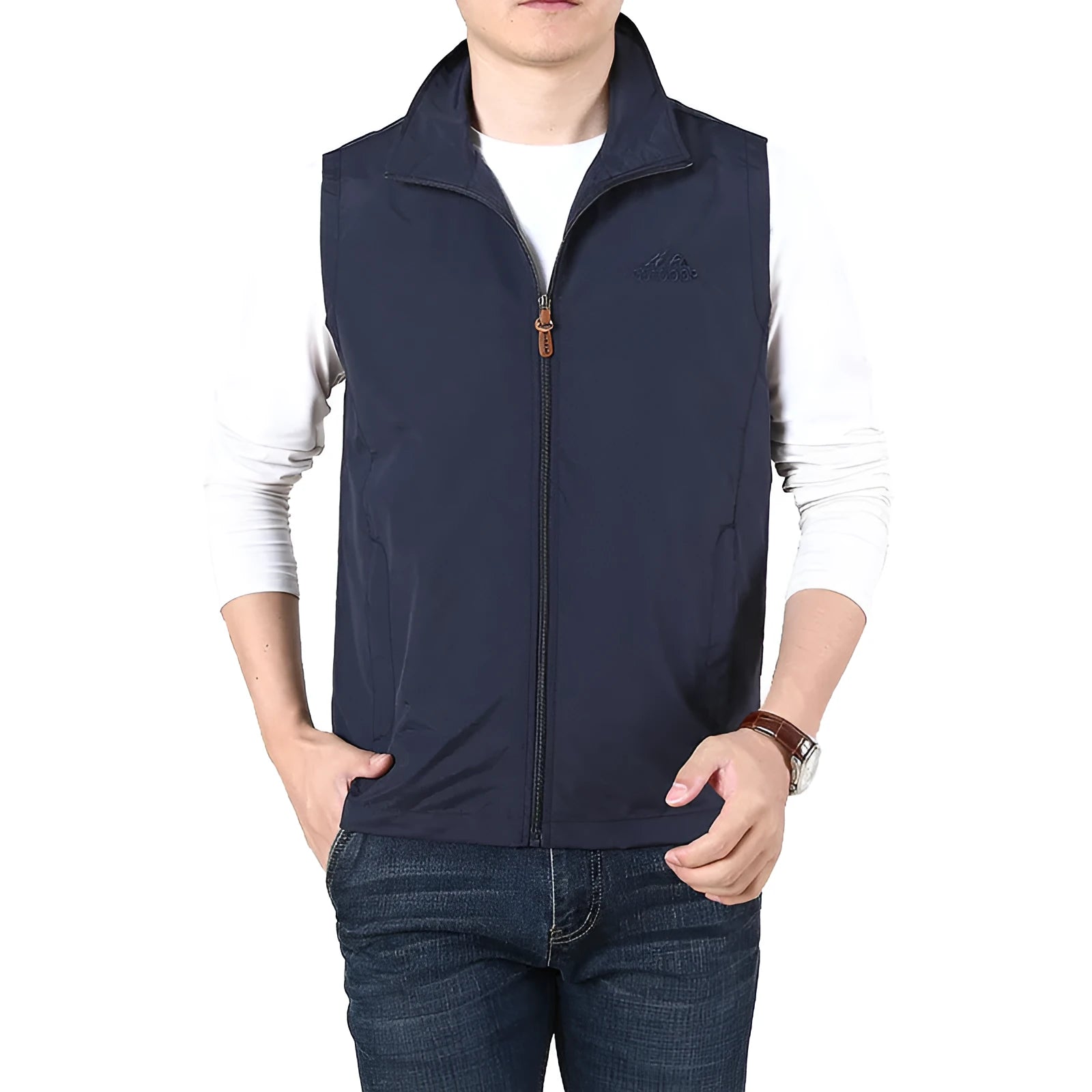 Man wearing a khaki casual waistcoat with side pockets over a blue shirt.