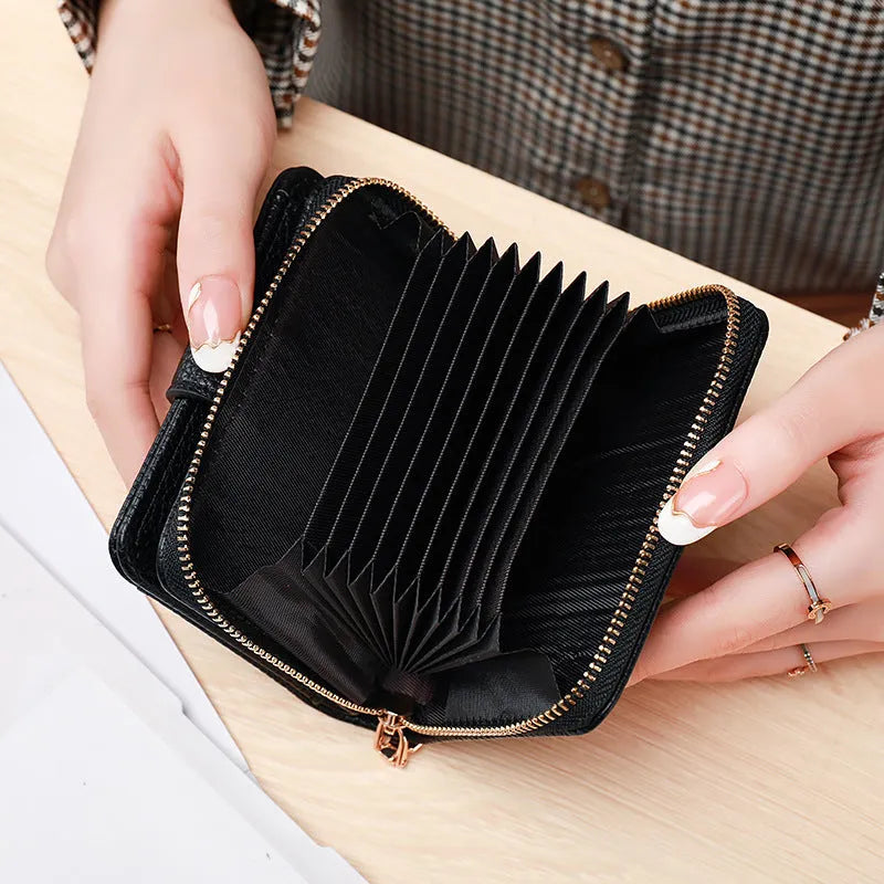 A ladies' short folded wallet with a lychee pattern, shown in beige, pink, black, and red colour options.