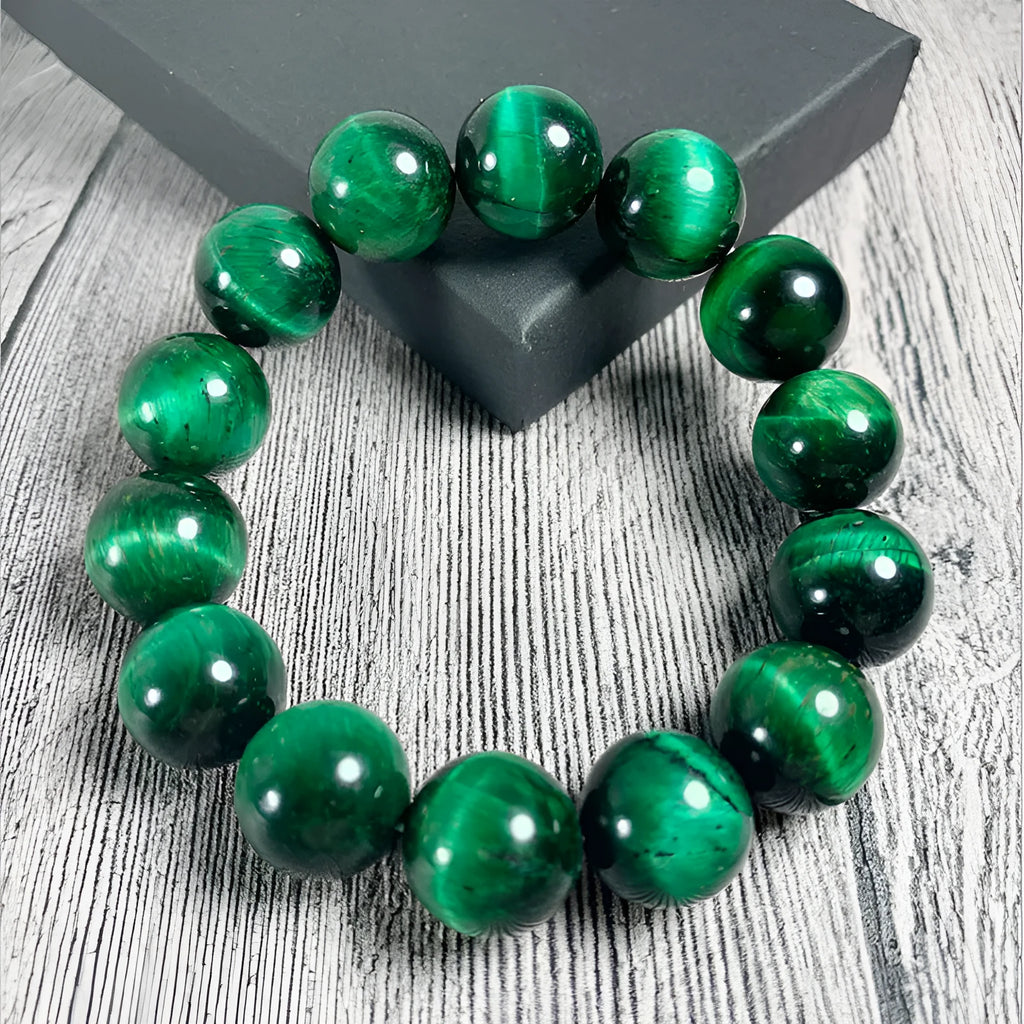 Natural green tiger eye stone bracelet with polished geometric beads in multiple sizes