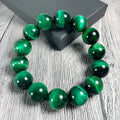 Natural green tiger eye stone bracelet with polished geometric beads in multiple sizes