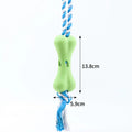 Green pet porous bone rope knot chew toy for dogs with treat stuffing openings