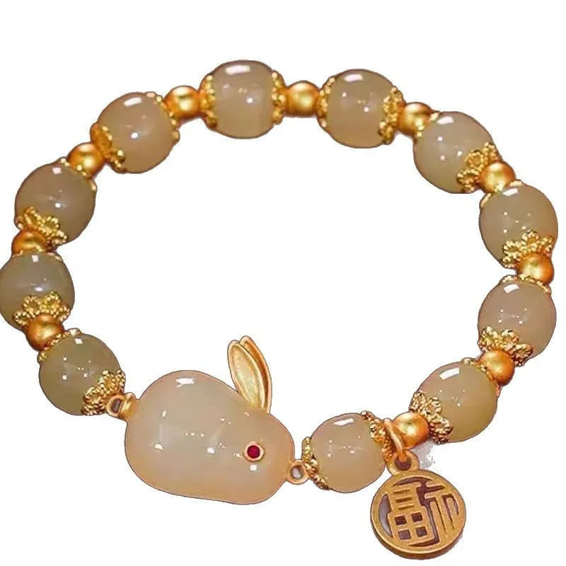 Simple women's bracelet with a peace buckle charm, coloured glass beads, and a small rabbit charm.