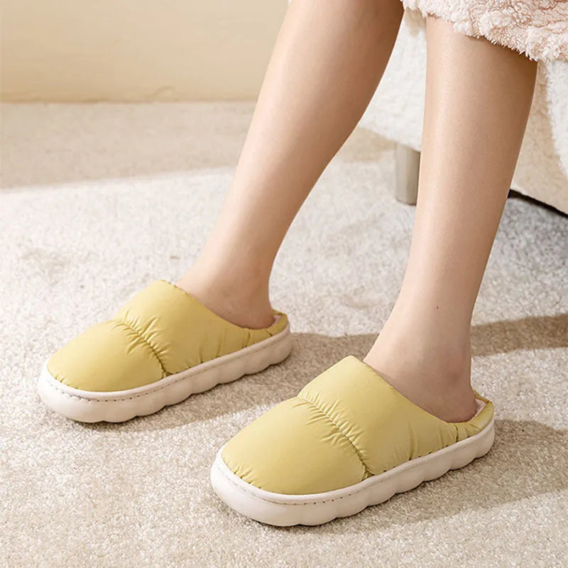 Down cotton house slippers with artificial leather upper, rubber sole, and plush lining in blue colour