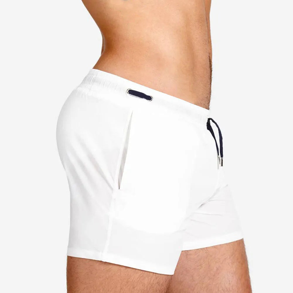 Men's mesh-lined swimming shorts in solid colours for sports and fitness activities
