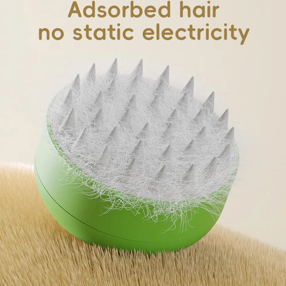 Green and yellow rechargeable silicone steam brush for grooming cats and dogs on a table.