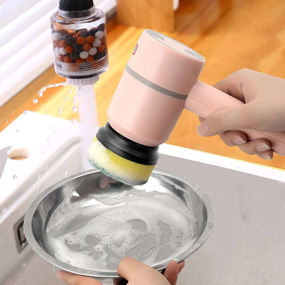 Green electric cleaning brush with multiple rotating brush heads on a kitchen countertop.