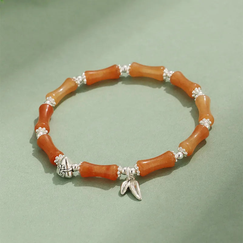 Electroplated bamboo strawberry crystal bracelet for women in green aventurine, showing natural stones on a bracelet.