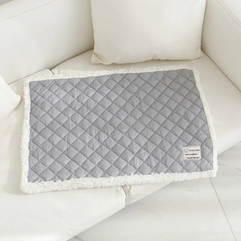 Quilted blue cloth pet blanket for cats shown in a large 80x60cm size.