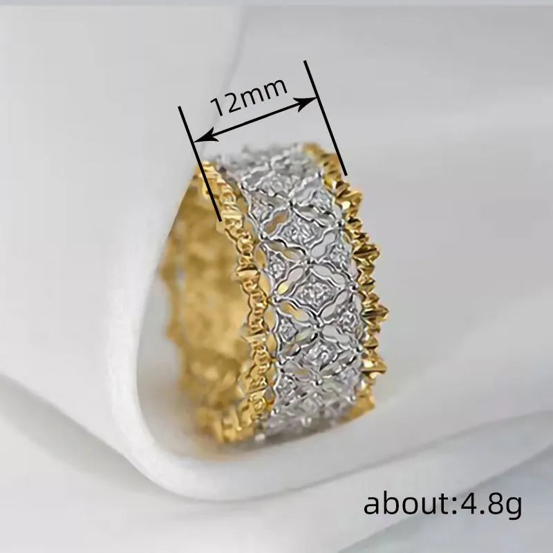 Geometric two-tone zircon copper ring showing electroplated finish and round stone elements.