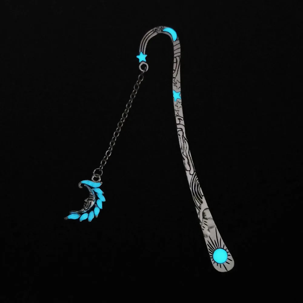 Retro five-pointed star metal bookmark glowing with celestial sun moon stars design