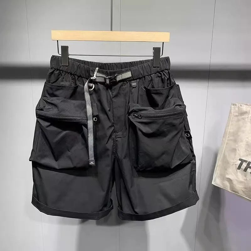 Men's large size loose fitting black shorts with pockets and straight leg hem.