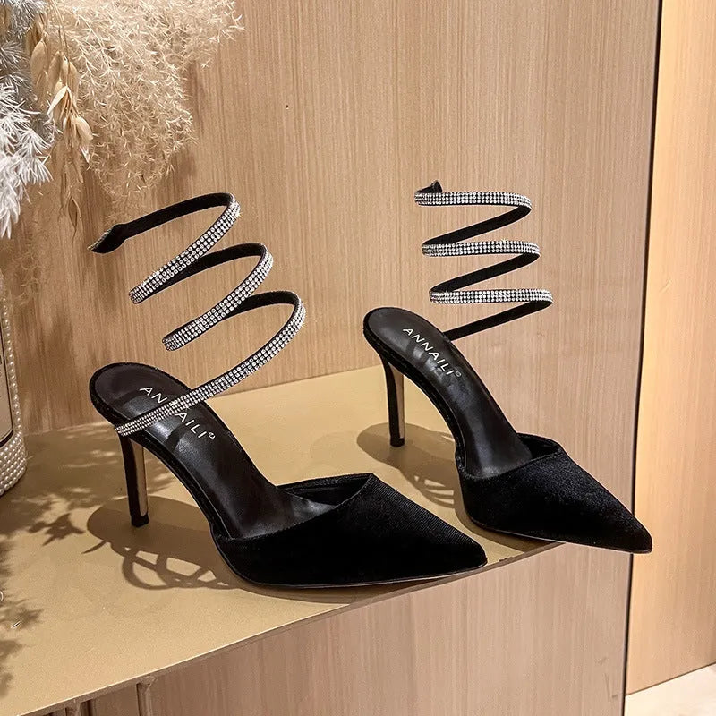 Women's pointed stiletto heel high heels in black velvet with ankle strap cross tie closure