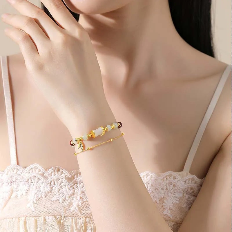 Bamboo bracelet with glass flower charm and Ruyi pattern in beige, green, light green, or white
