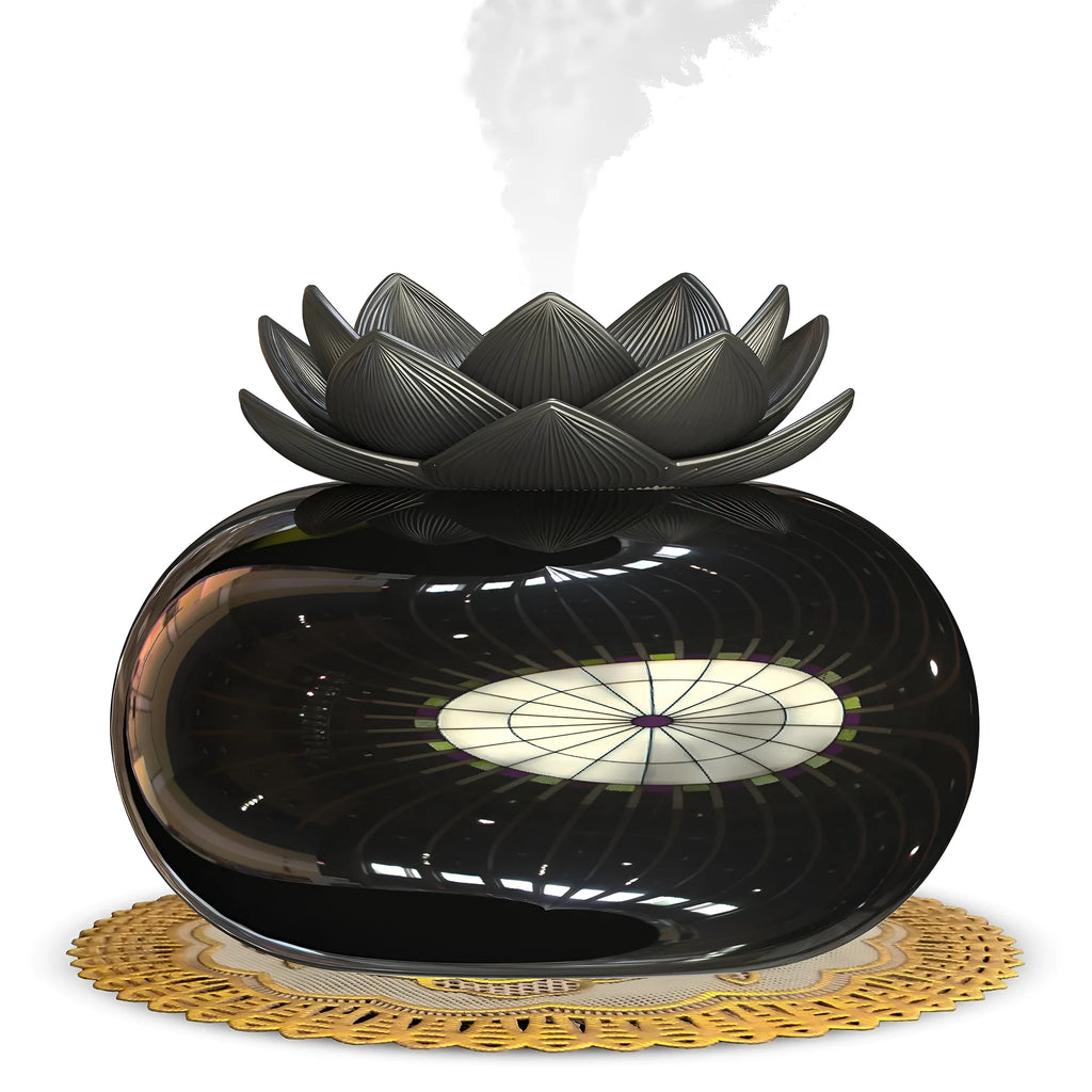 Pure black lotus-shaped USB aromatherapy humidifier on a desk.