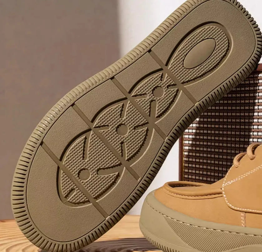 British retro style brown leather casual shoes with big toe design on a white background.