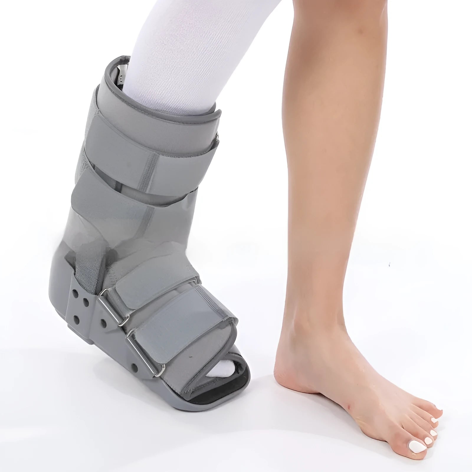Black adjustable Achilles tendon rehabilitation boot with aluminium struts, shown on a foot.