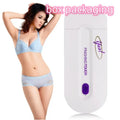White rechargeable electric hair removal instrument with foil head and cleaning brush on a table.
