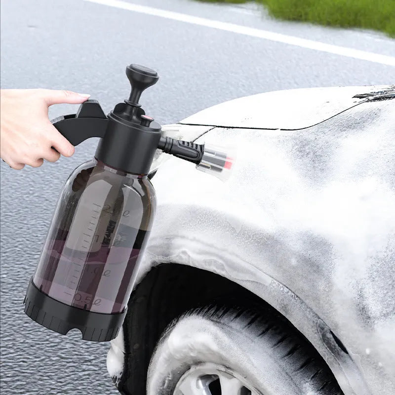 Black hand-held foam sprayer with a 2-litre capacity bottle and pump mechanism.