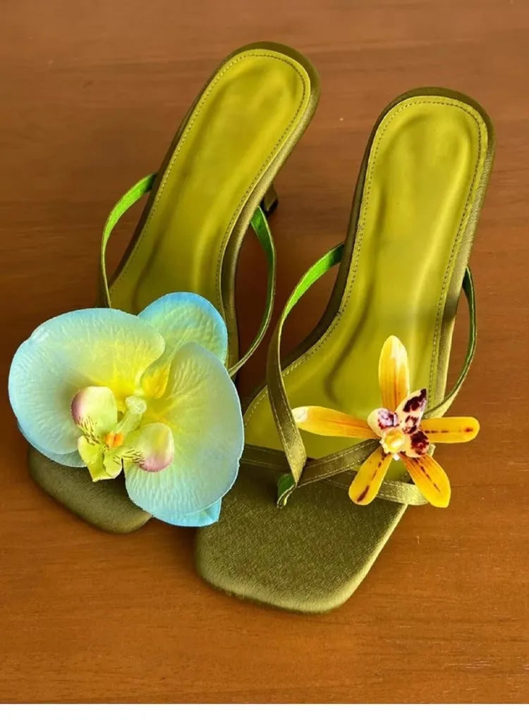 Women's handmade asymmetric flower design sandals in calf leather with a high heel and square toe.
