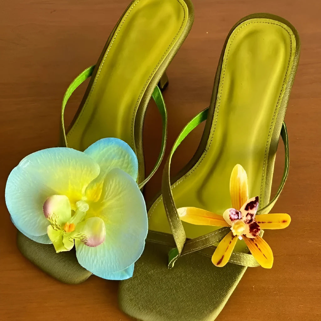 Women's handmade asymmetric flower design sandals in calf leather with a high heel and square toe.