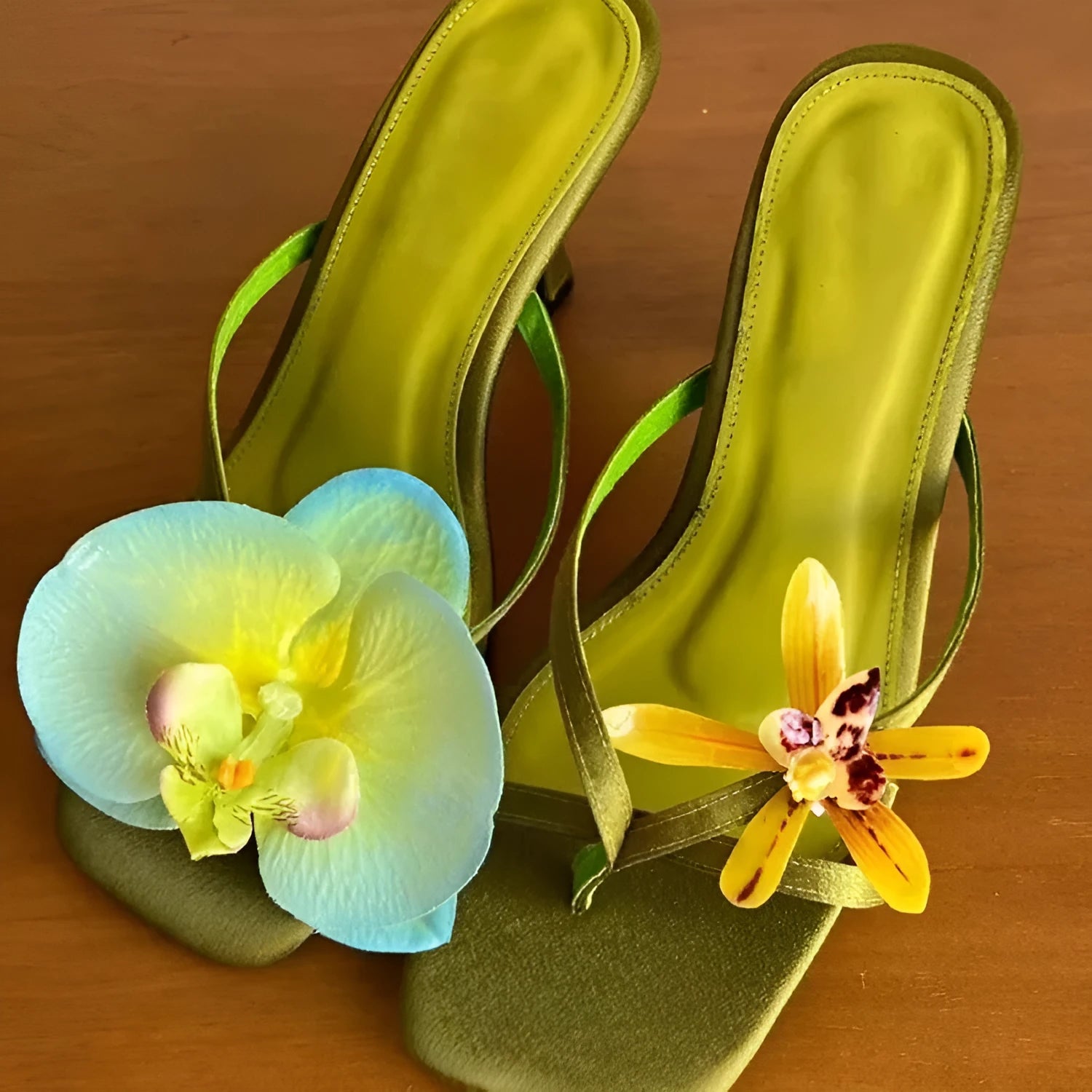 Women's handmade asymmetric flower design sandals in calf leather with a high heel and square toe.