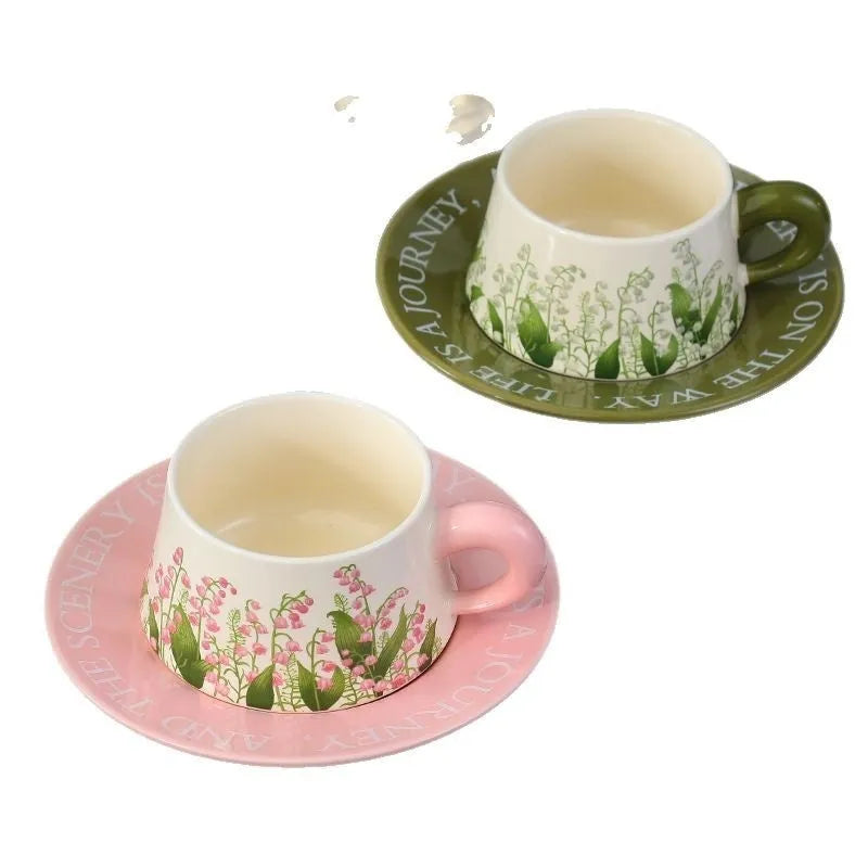 Ceramic coffee cup and saucer set for two with stirring spoons in Hanging Bell or Lanling Grass patterns.