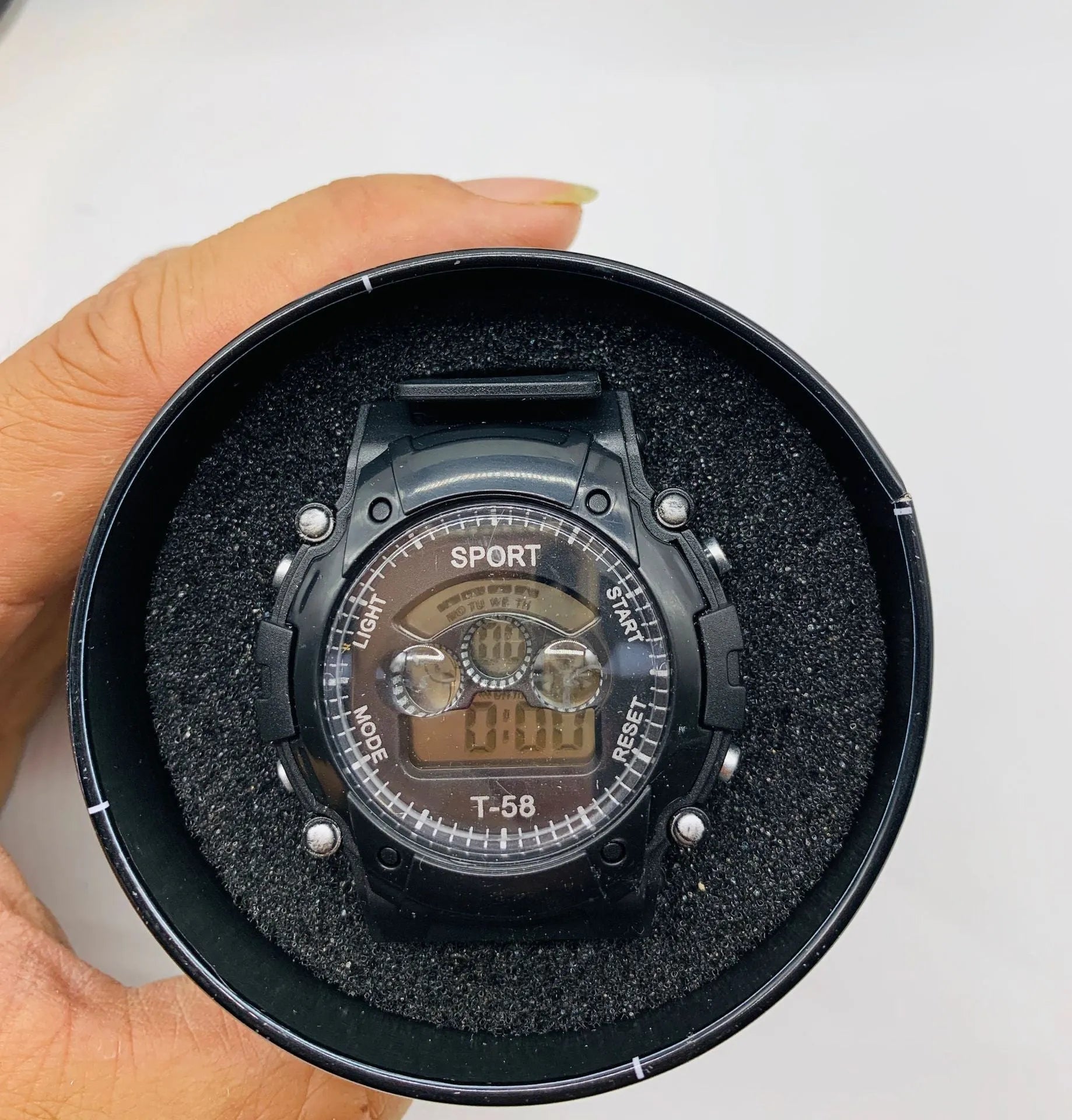Children's digital sports watch with silicone strap and plastic case showing multiple functions including alarm and countdown timer