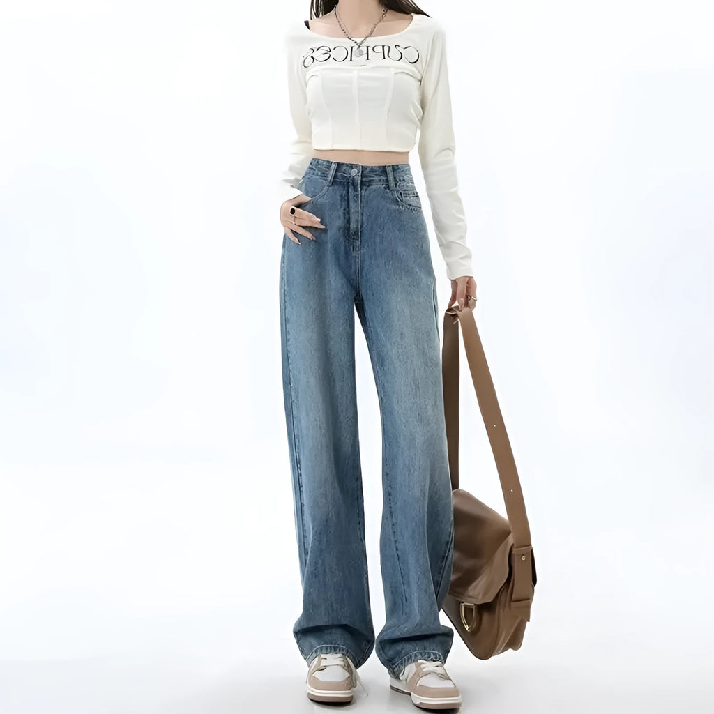 Woman wearing retro blue high-waisted wide-leg jeans with a straight-leg cut.