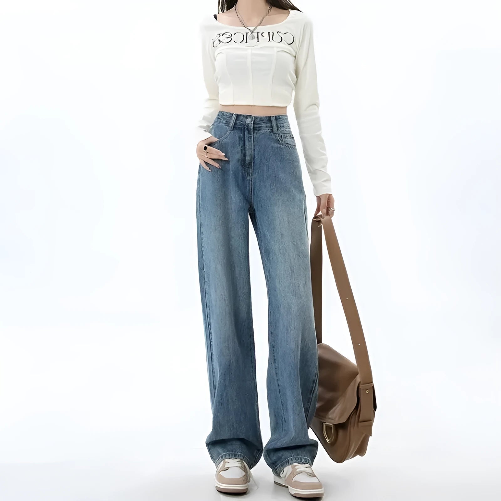 Woman wearing retro blue high-waisted wide-leg jeans with a straight-leg cut.