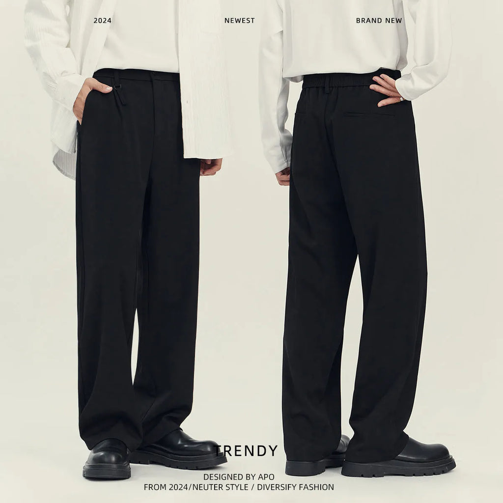 Man's black loose straight-leg business casual trousers made from a draping polyester blend fabric.