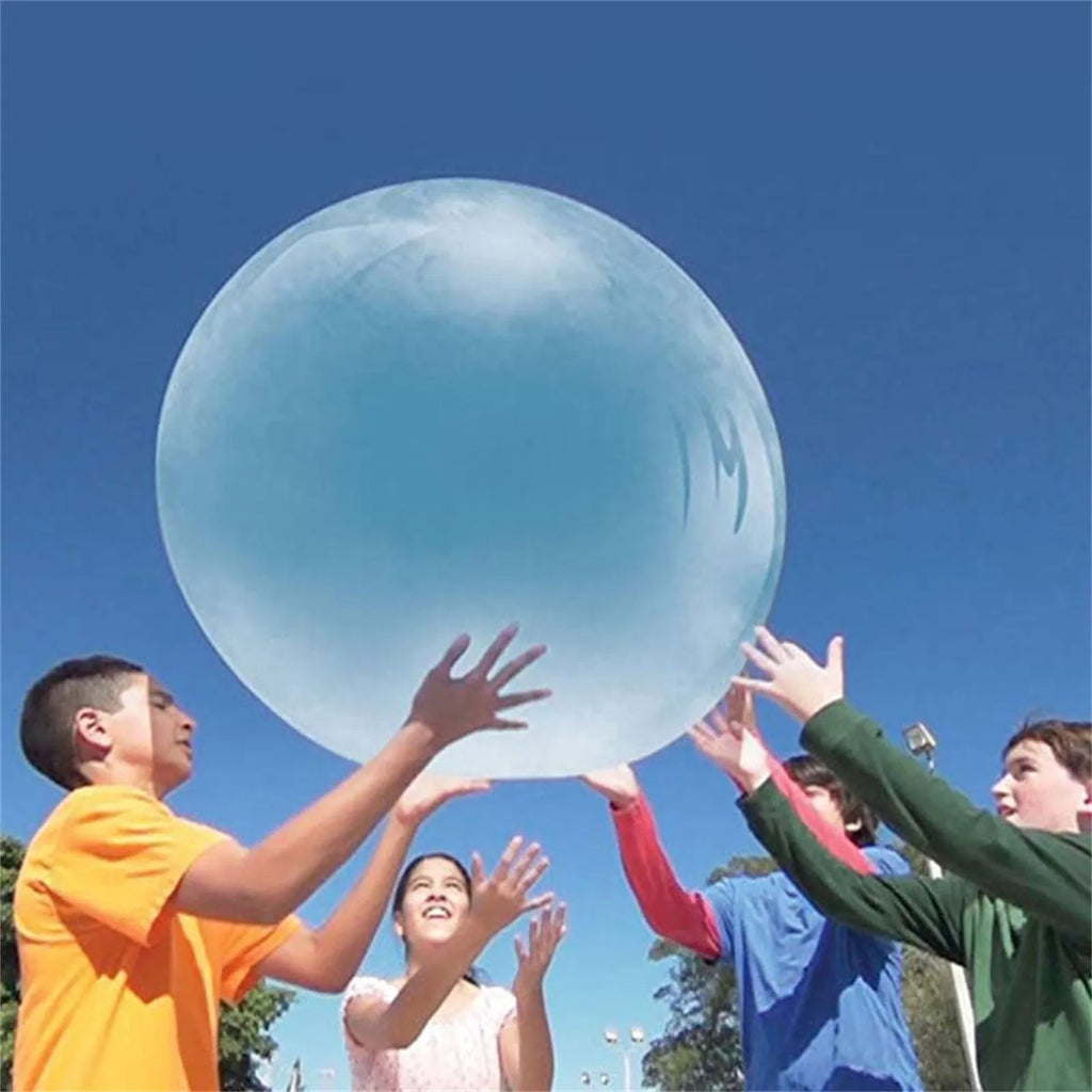 Large pink, yellow, green, and blue inflatable bouncy balls in different sizes for children's parties