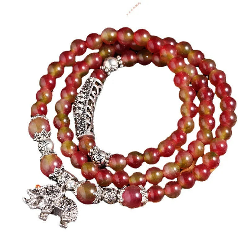 Handmade natural watermelon crystal bracelet with Chinese knot design and geometric beads in elephant style colours