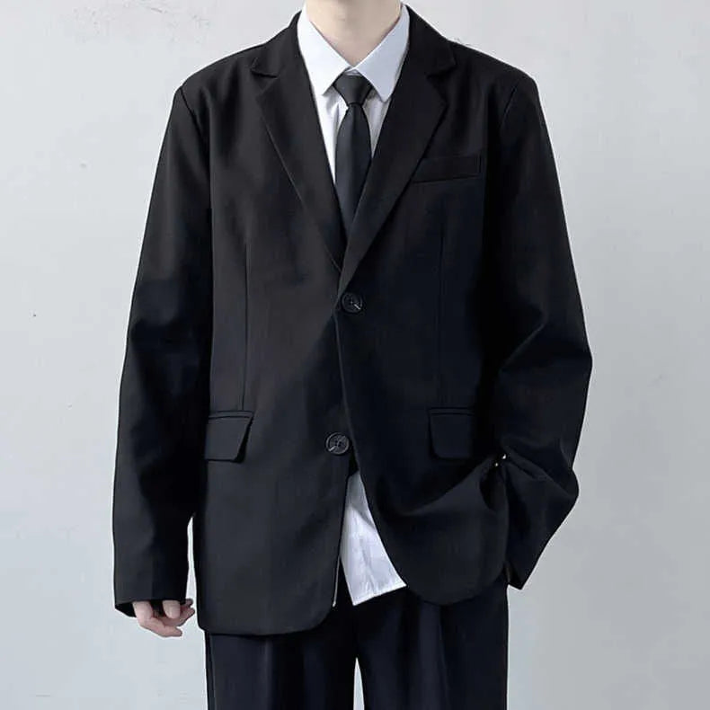 Plus size men's grey suit jacket and trousers set with white shirt and blue tie on a hanger