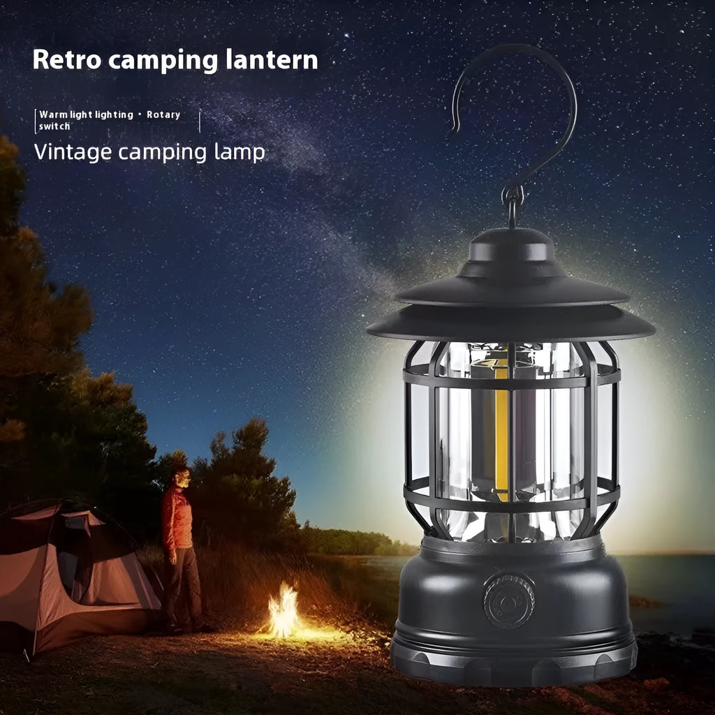 Dark green portable camping head lamp with compact dimensions for outdoor use.