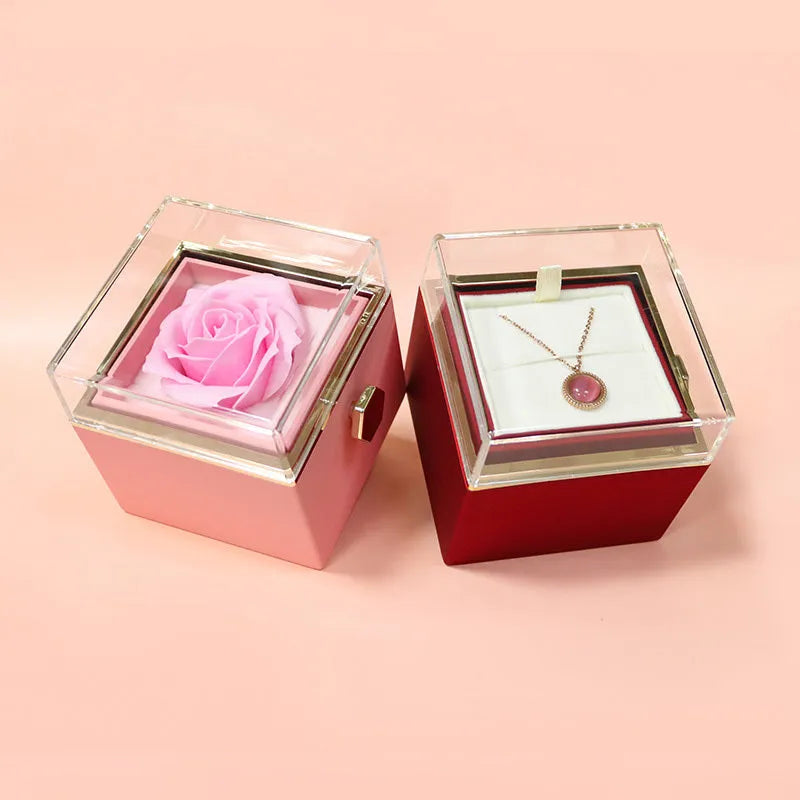 Rotating rose jewellery gift box with preserved real flower under acrylic cover and rotating drawer