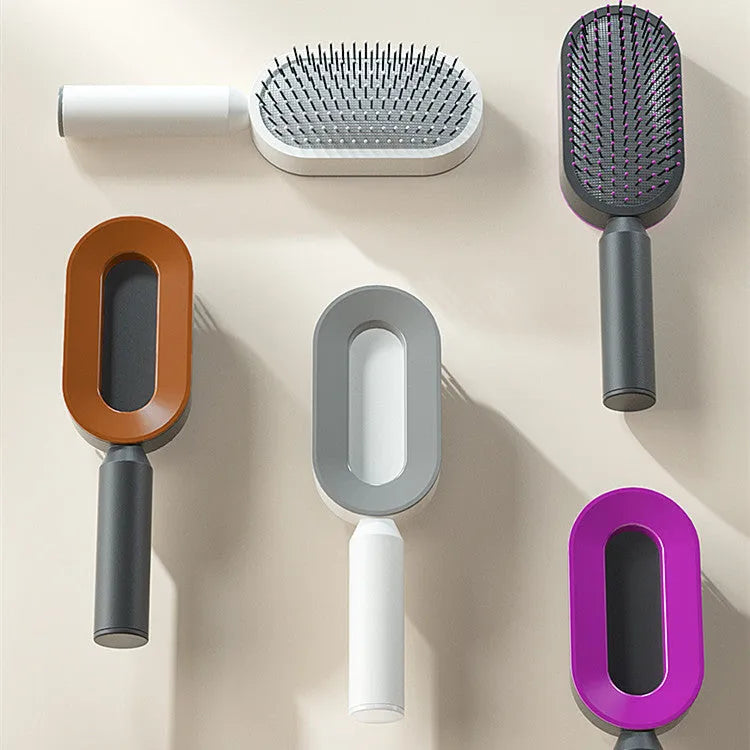 Self-cleaning hair brush with one-key button, air cushion base, and long bristles on a white background.