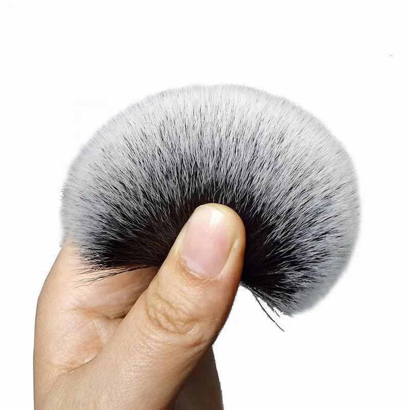 Black car detailing brush with ultra-soft pig hair bristles in two size options for gentle interior cleaning