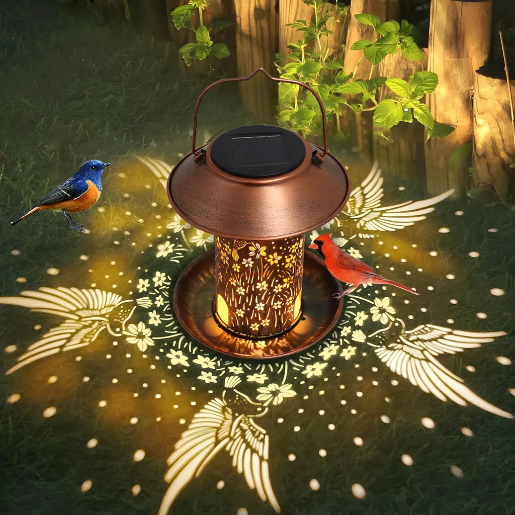 Iron art solar-powered bird feeder lamp with hummingbird pattern design for outdoor garden use.