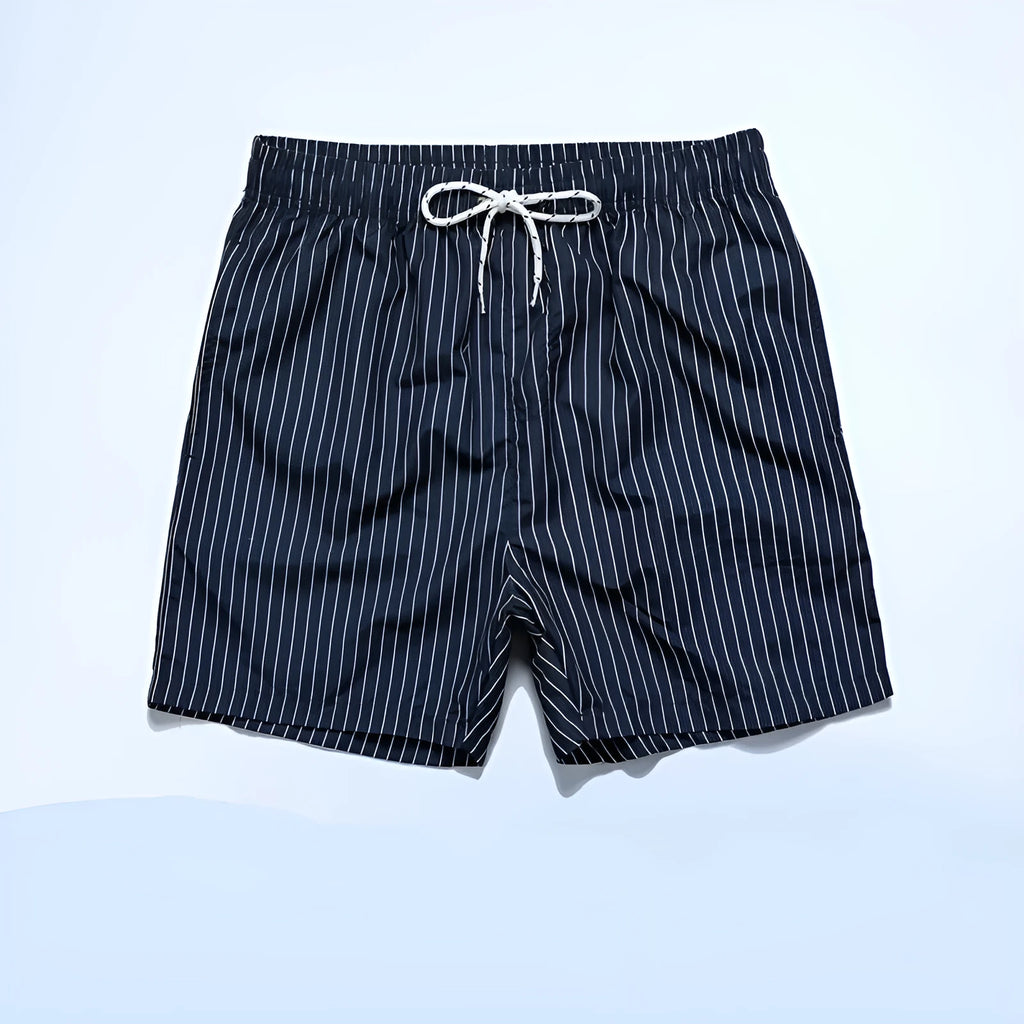 Polyester fibre striped beach shorts with triangle lining in navy blue, straight leg opening