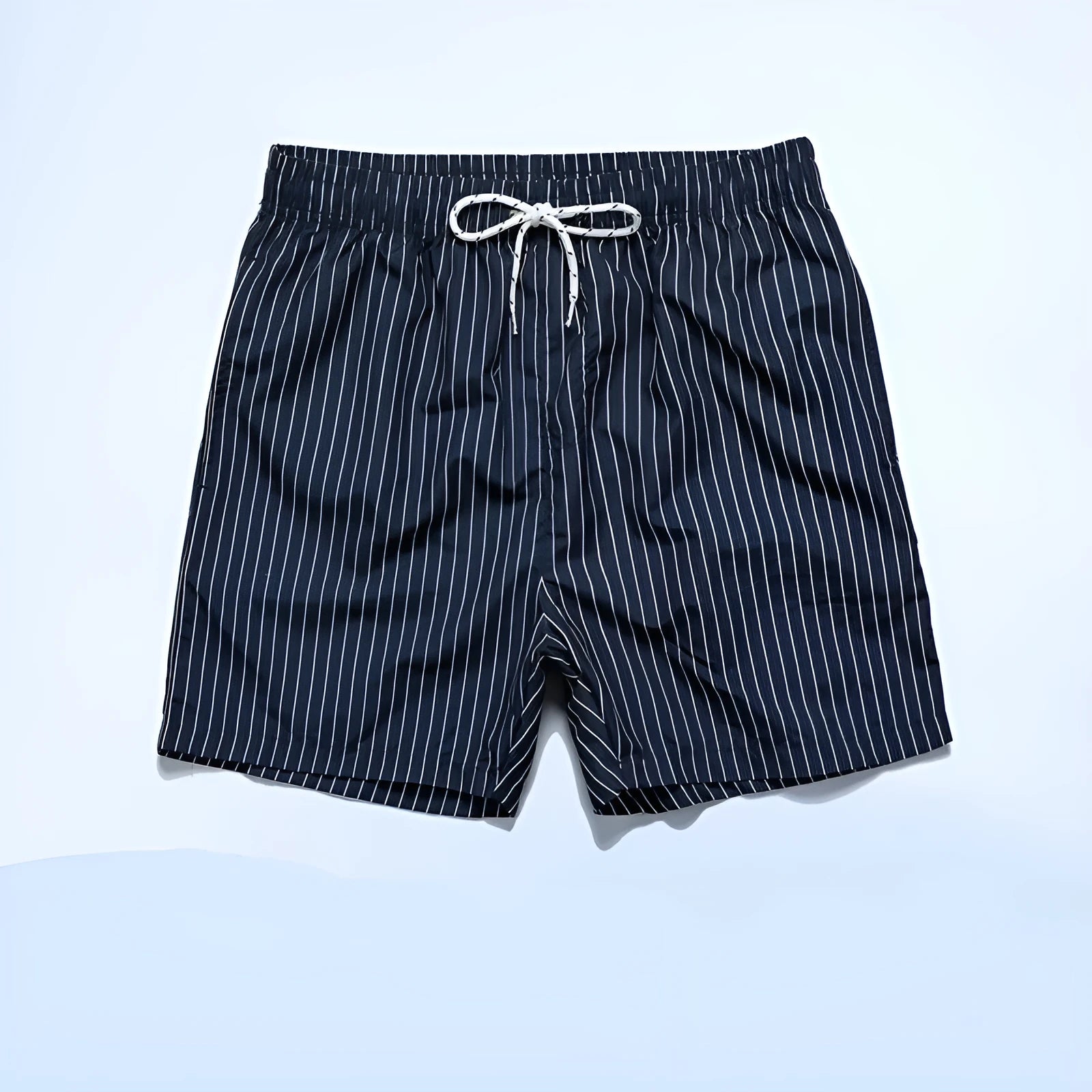 Polyester fibre striped beach shorts with triangle lining in navy blue, straight leg opening