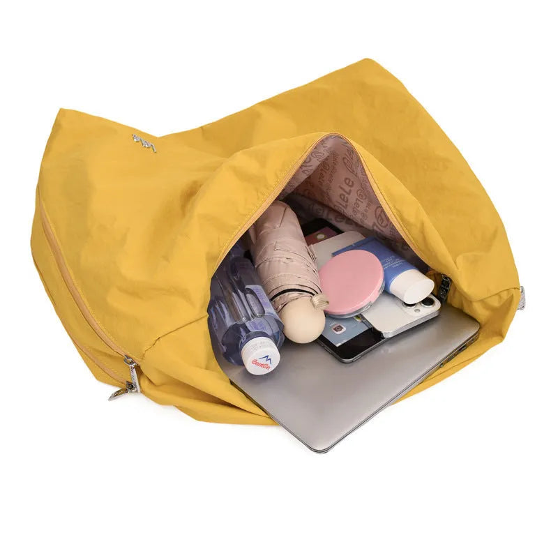 Women's heart-shaped nylon underarm bag in black, blue, khaki, and yellow colour options