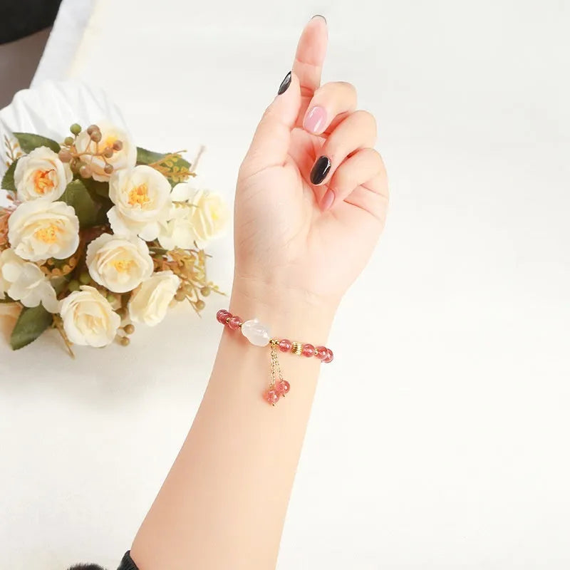 Natural strawberry quartz and agate bracelet for women with 6mm round beads and a white rabbit charm.