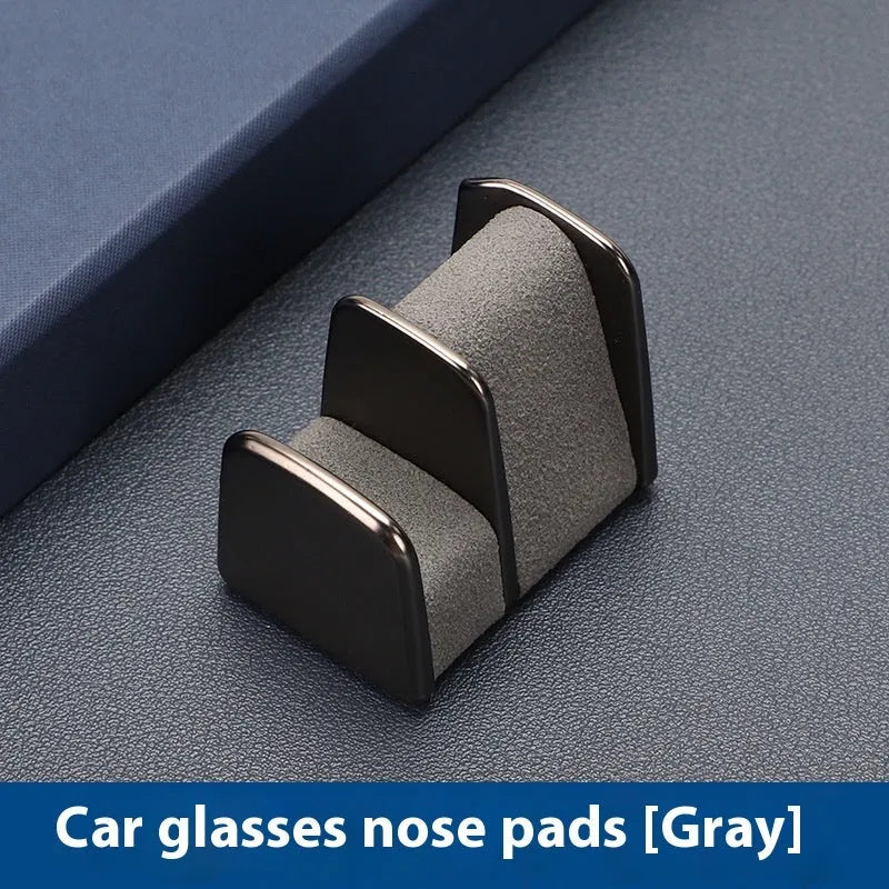 Zinc alloy and leather car dashboard glasses clip holder in green colour.