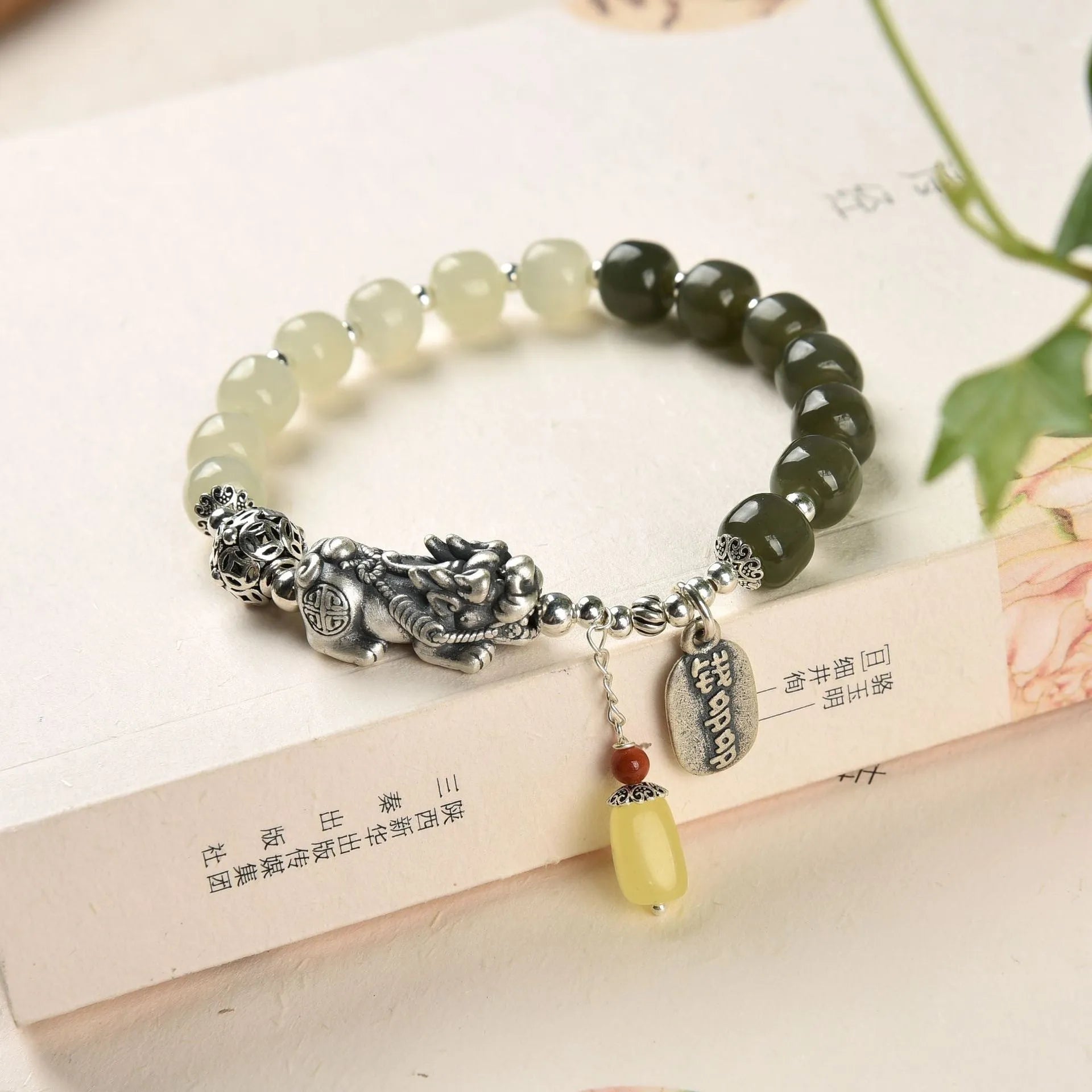 Retro-style pure silver bracelet for women with natural Hetian jade bead pendants.