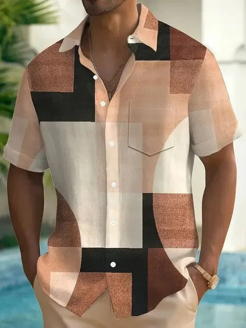 Man wearing a short sleeve cardigan with a blue and white retro geometric square print pattern.